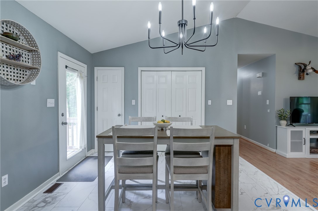 6716 Church Road Petersburg, VA 23803 - Photo 22 of 44 a view of a dining room with furniture and wooden floor
