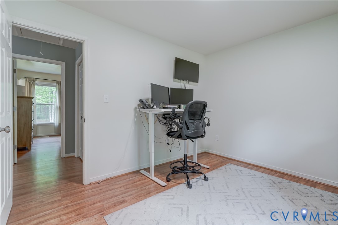 6716 Church Road Petersburg, VA 23803 - Photo 29 of 44 a view of workspace with wooden floor windows