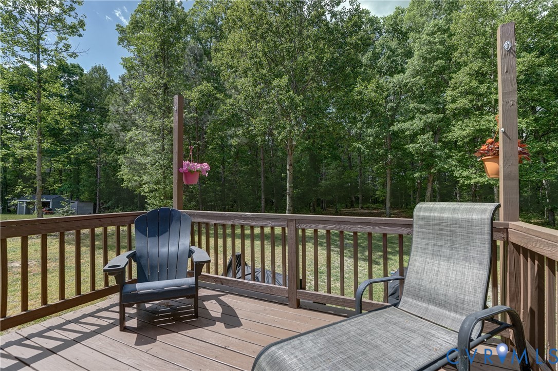 6716 Church Road Petersburg, VA 23803 - Photo 43 of 44 a view of a wooden deck and a backyard