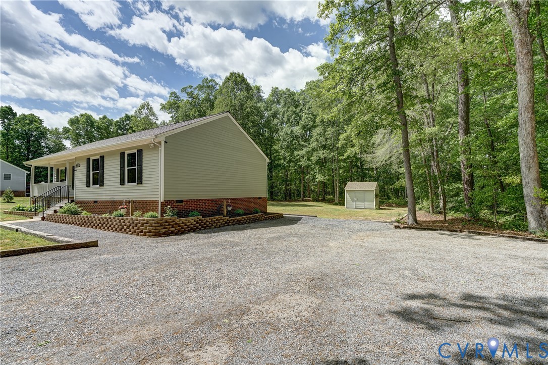 6716 Church Road Petersburg, VA 23803 - Photo 5 of 44 a view of a house with backyard and trees