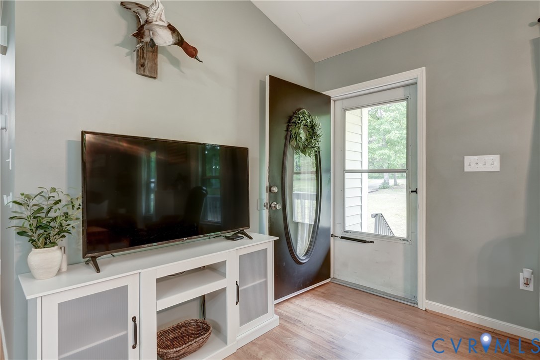 6716 Church Road Petersburg, VA 23803 - Photo 9 of 44 a living room with flat screen tv and floor to ceiling window