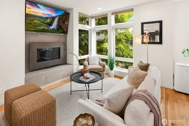 a living room with furniture and a fireplace