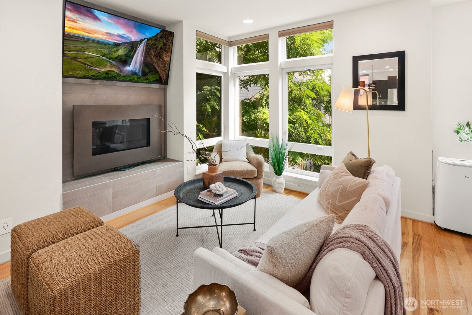 a living room with furniture and a fireplace