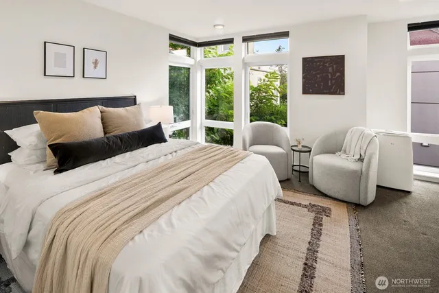 a bed room with a bed and a night stand