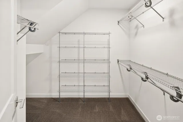 a view of a hallway with washer and dryer