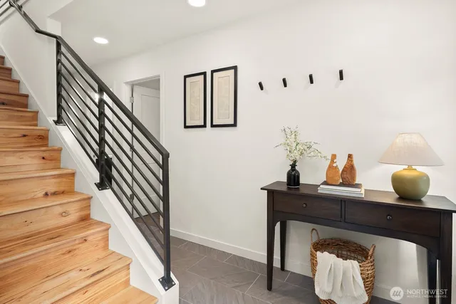 a view of entryway with stairs and wooden floor