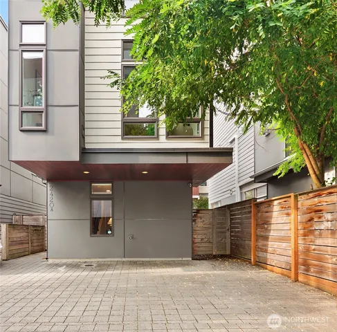 a living room with furniture kitchen view and a fireplace