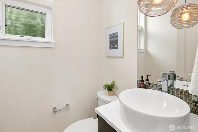 a bedroom with bed and a large window