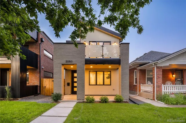 a front view of a house with a yard and porch