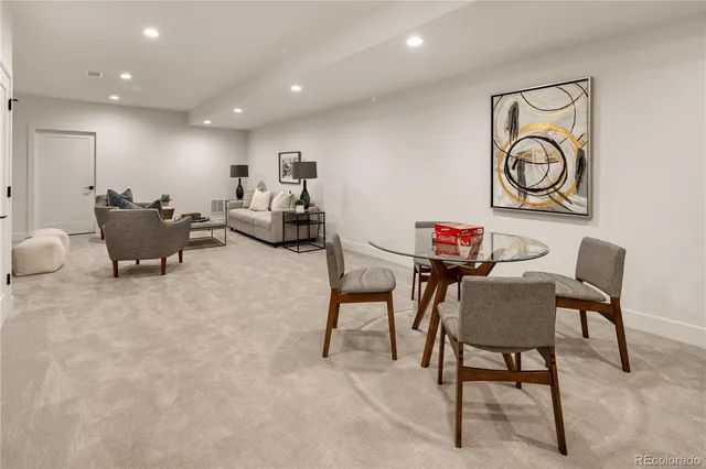 a living room with furniture and a rug
