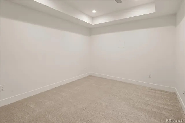 a view of balcony with wooden floor and fence