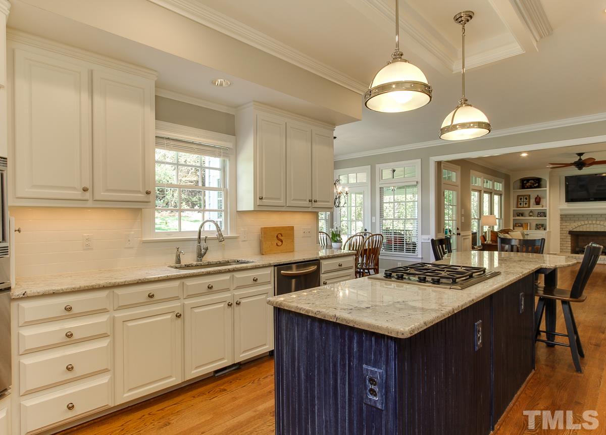 7260 Manor Oaks Drive Raleigh, NC 27615 - Photo 10 of 25 Great layout in kitchen with large center island and window over sink.