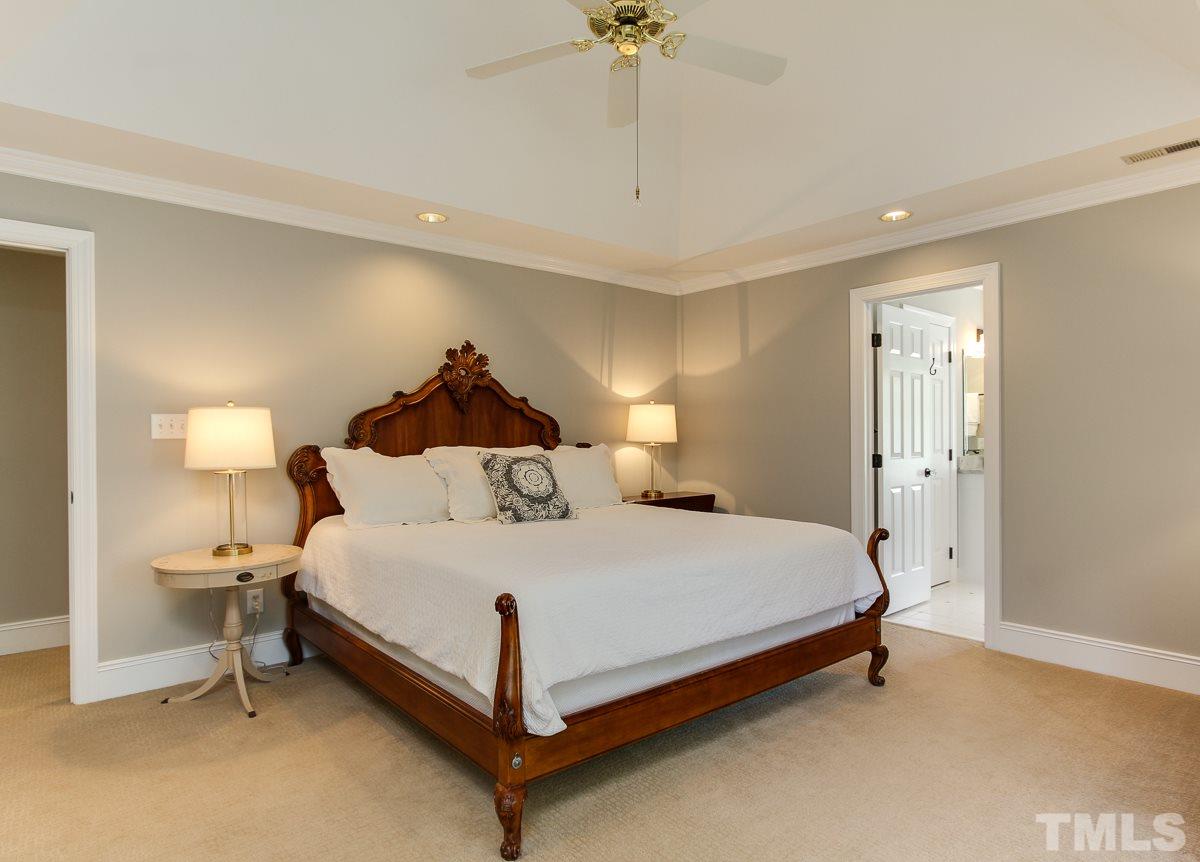 7260 Manor Oaks Drive Raleigh, NC 27615 - Photo 12 of 25 Master bedroom has nice sitting area with cathedral ceiling. Windows overlooking backyard.