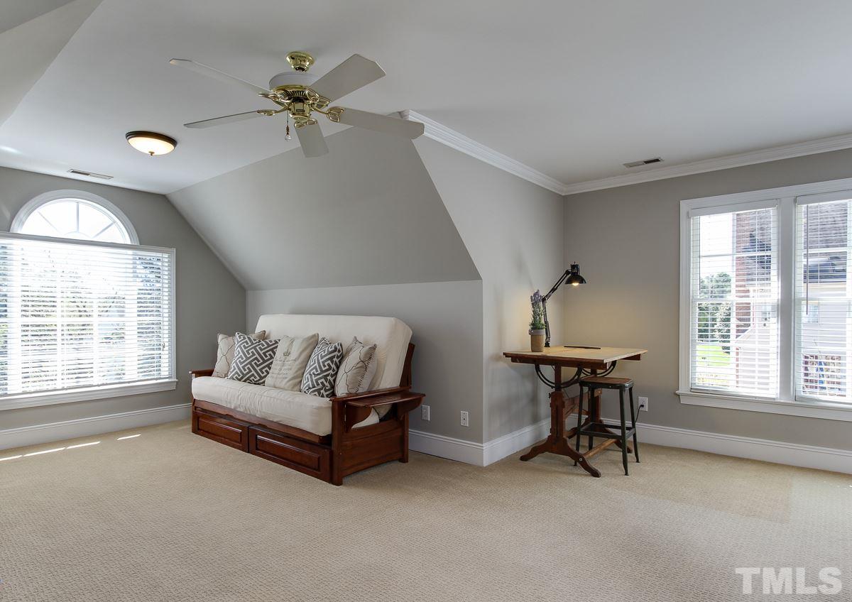 7260 Manor Oaks Drive Raleigh, NC 27615 - Photo 16 of 25 Spacious bonus room open to upstairs hall and back staircase.