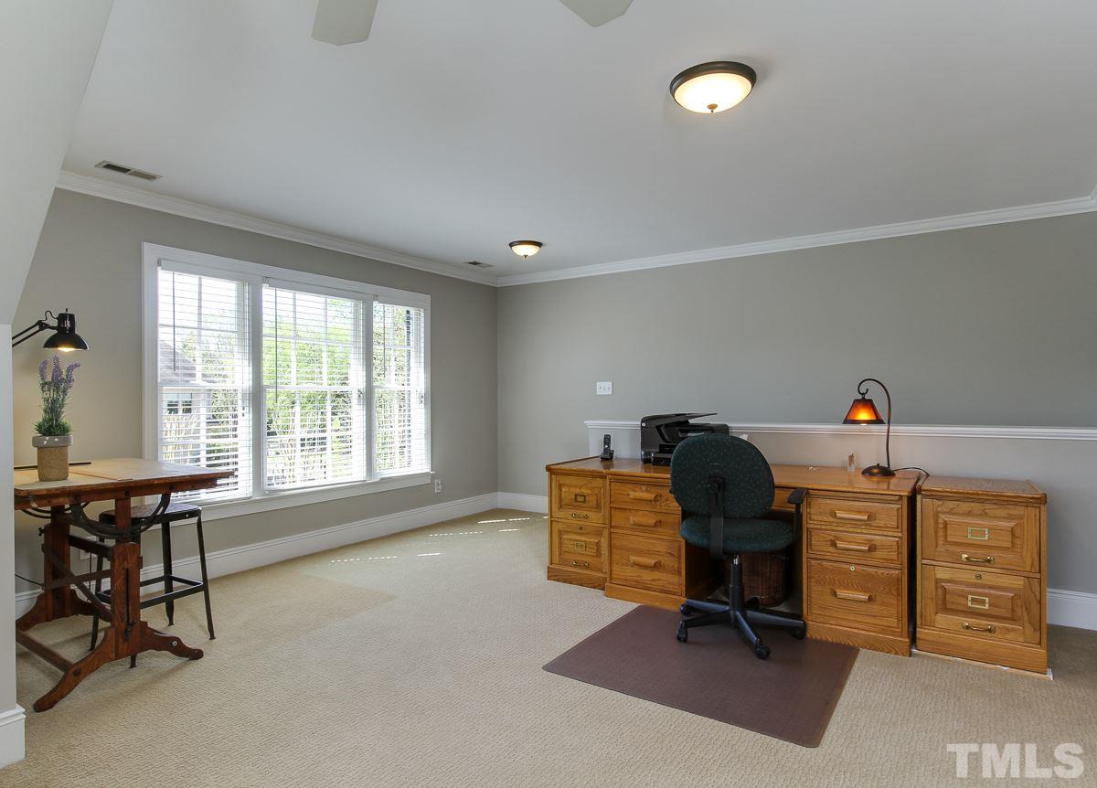 7260 Manor Oaks Drive Raleigh, NC 27615 - Photo 17 of 25 Bonus room has lots of natural light and back staircase.