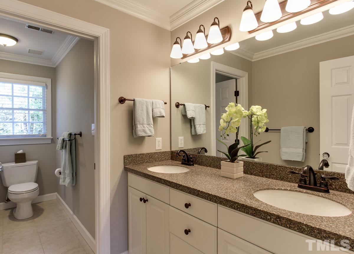 7260 Manor Oaks Drive Raleigh, NC 27615 - Photo 22 of 25 This 3rd bathroom has double vanity and tub/shower combo.