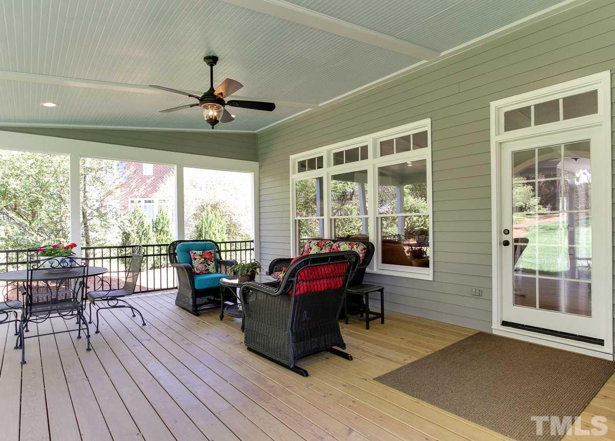7260 Manor Oaks Drive Raleigh, NC 27615 - Photo 23 of 25 This lovely covered porch is 17'x21'...plenty of room for outdoor dining and lounging. Beadboard ceiling and ceiling fan. There is a nice patio off of the porch for grilling.