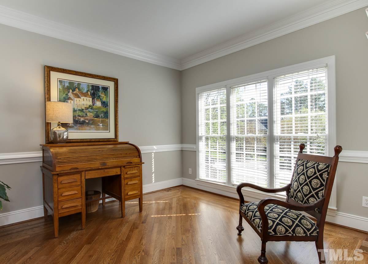 7260 Manor Oaks Drive Raleigh, NC 27615 - Photo 4 of 25 This flex room can be home office, living room, or play room. Hardwood floors and large windows overlooking quiet front yard.
