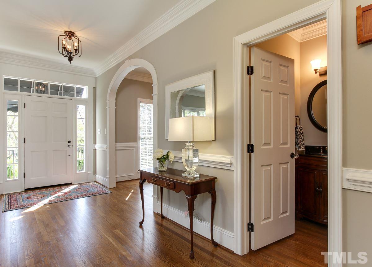 7260 Manor Oaks Drive Raleigh, NC 27615 - Photo 5 of 25 Spacious foyer with arched entries into dining room and study. Newly refinished hardwood floors throughout main level.