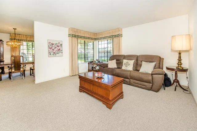 a view of a dining room with furniture window and outside view