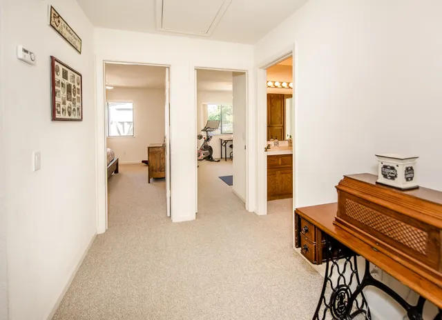 a bed room with a bed and a chandelier