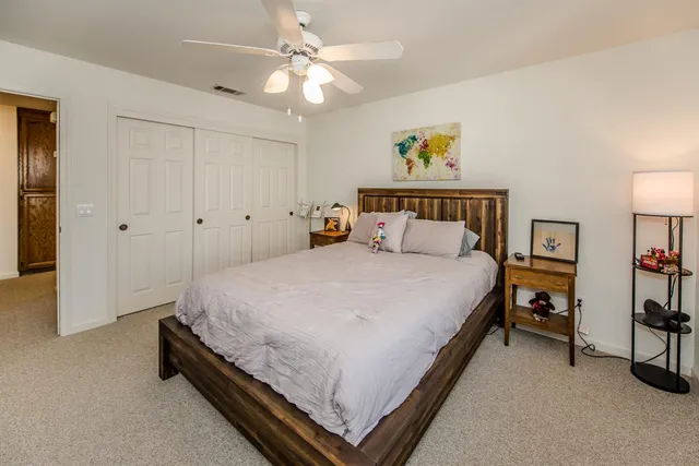 a spacious bathroom with a double vanity sink a mirror and a bathtub
