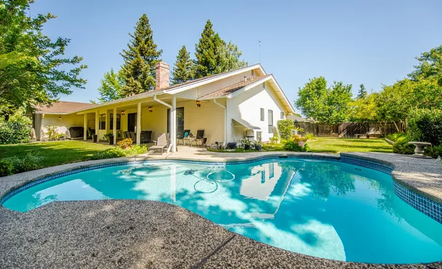 a backyard of a house with seating space