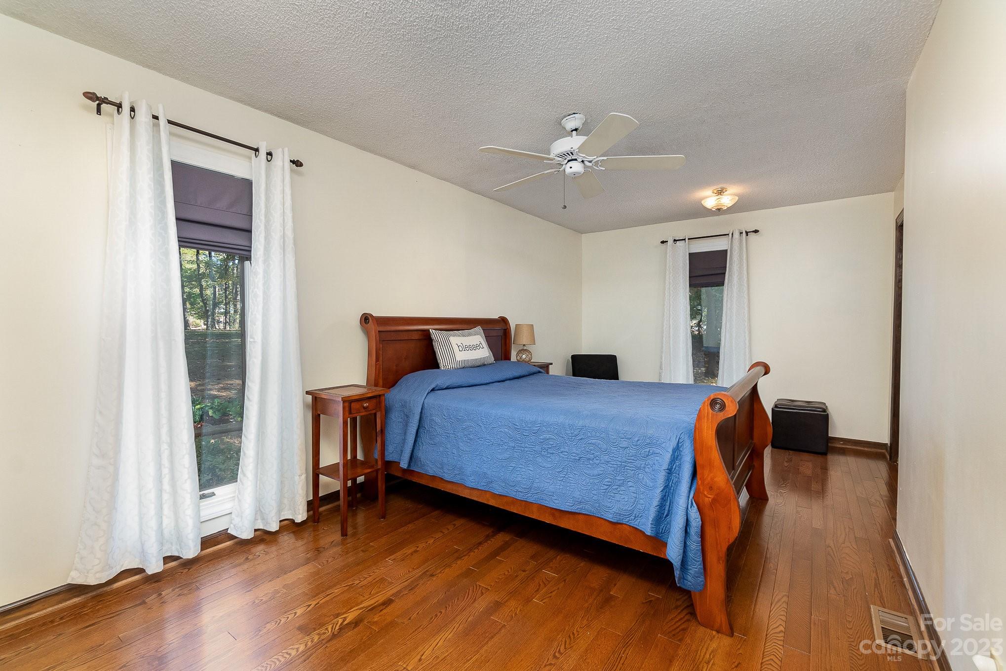 31 Robinwood Drive Midland, NC 28107 - Photo 17 of 33 a bedroom with a bed and wooden floor