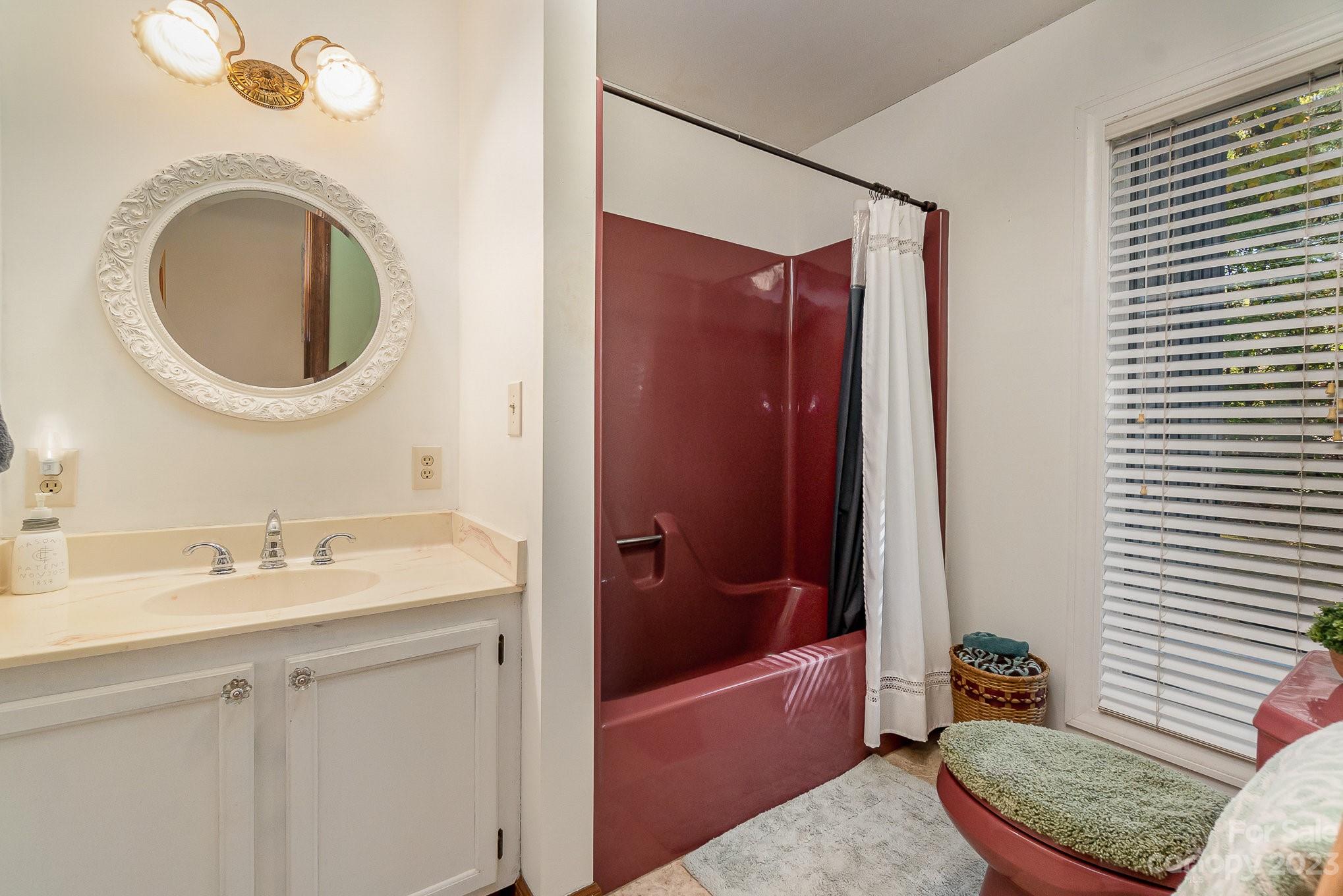 31 Robinwood Drive Midland, NC 28107 - Photo 18 of 33 a bathroom with a granite countertop sink and a mirror
