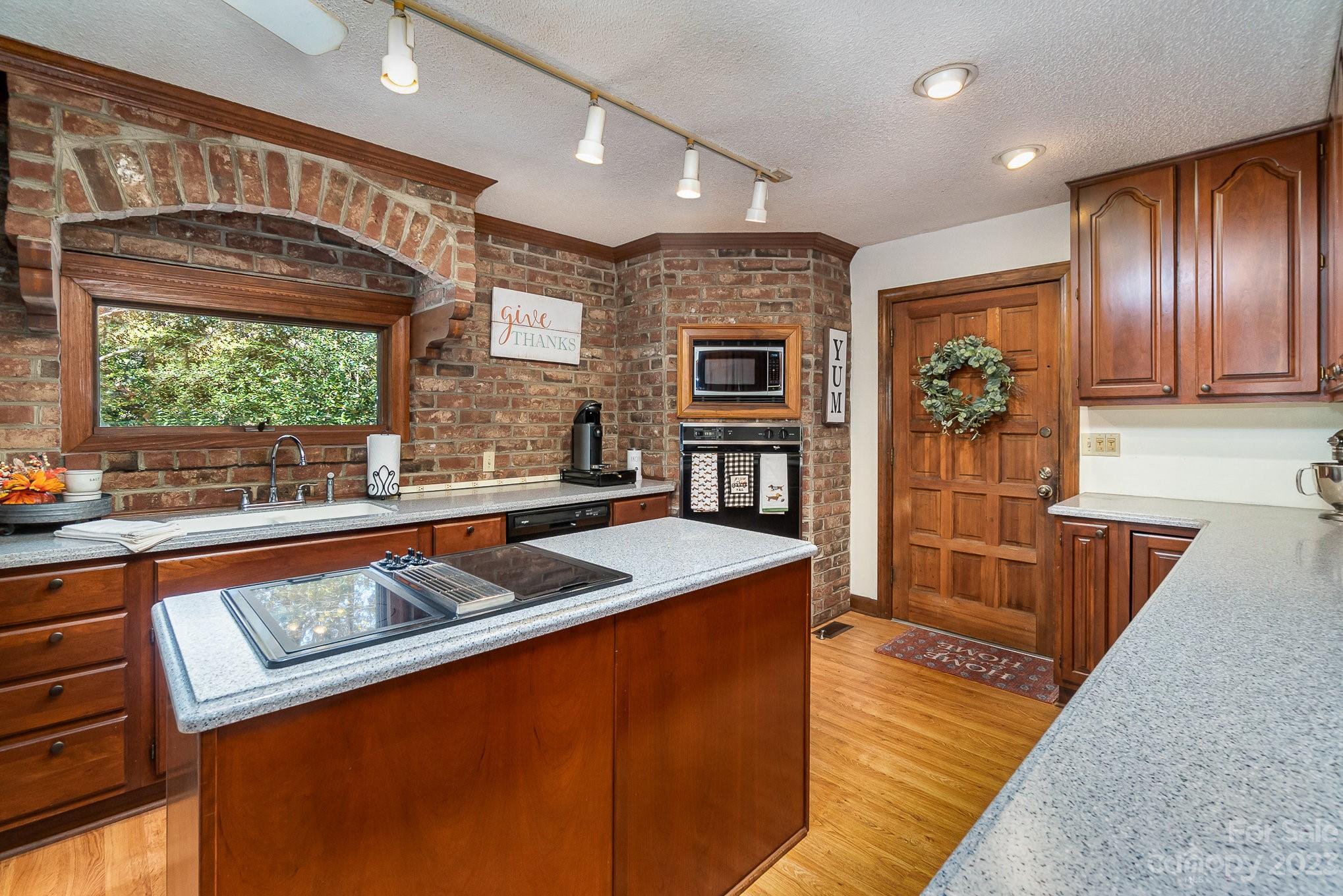 31 Robinwood Drive Midland, NC 28107 - Photo 4 of 33 a kitchen with stainless steel appliances granite countertop a stove a sink and a microwave