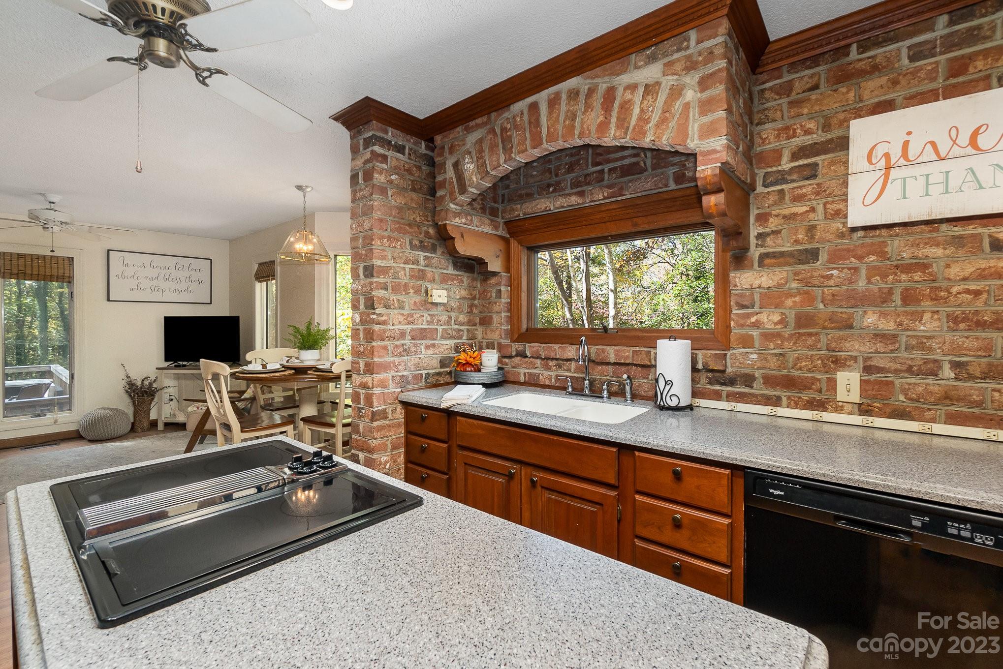 31 Robinwood Drive Midland, NC 28107 - Photo 5 of 33 a kitchen with a stove a sink and a wooden cabinets