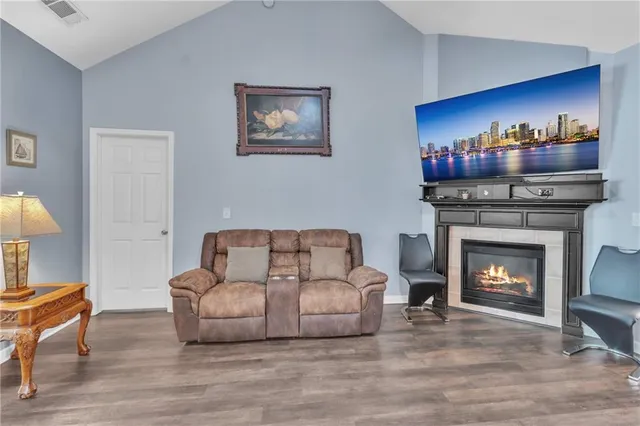 a living room with furniture and a fireplace