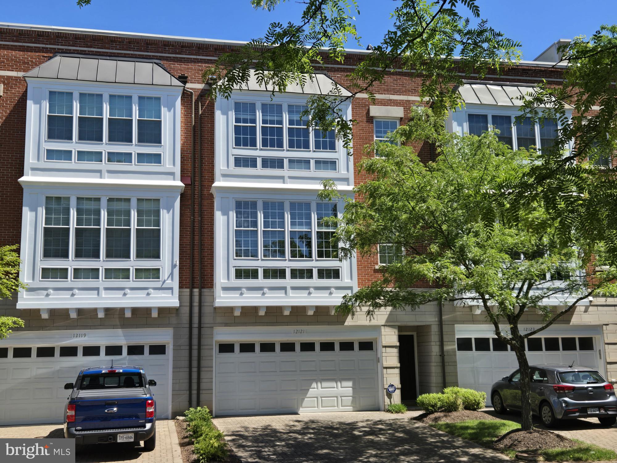 12121 Kinsley Place Reston, VA 20190 - Photo 34 of 45 Rear Garage-side of All-brick Townhome