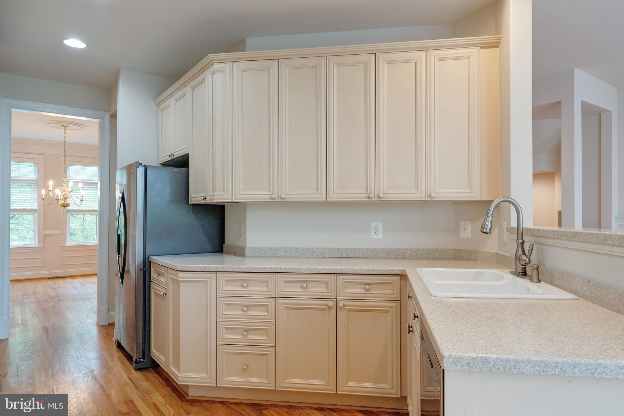 12121 Kinsley Place Reston, VA 20190 - Photo 9 of 45 Kitchen with Tall Ceilings and Hardwood Floors