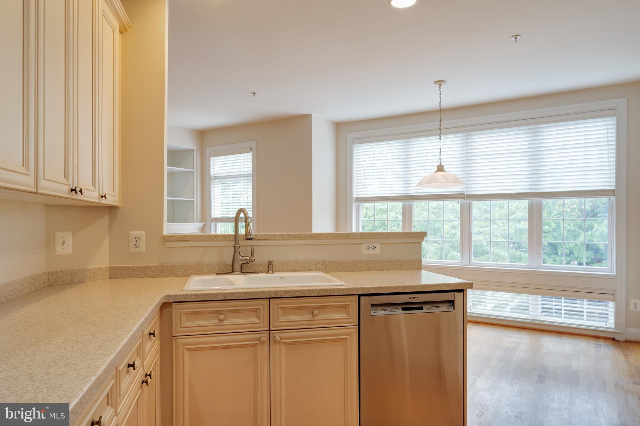 12121 Kinsley Place Reston, VA 20190 - Photo 10 of 45 Kitchen Opening to Breakfast Area and Family Room