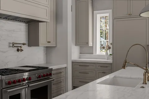 a spacious bedroom with a bed and a chandelier