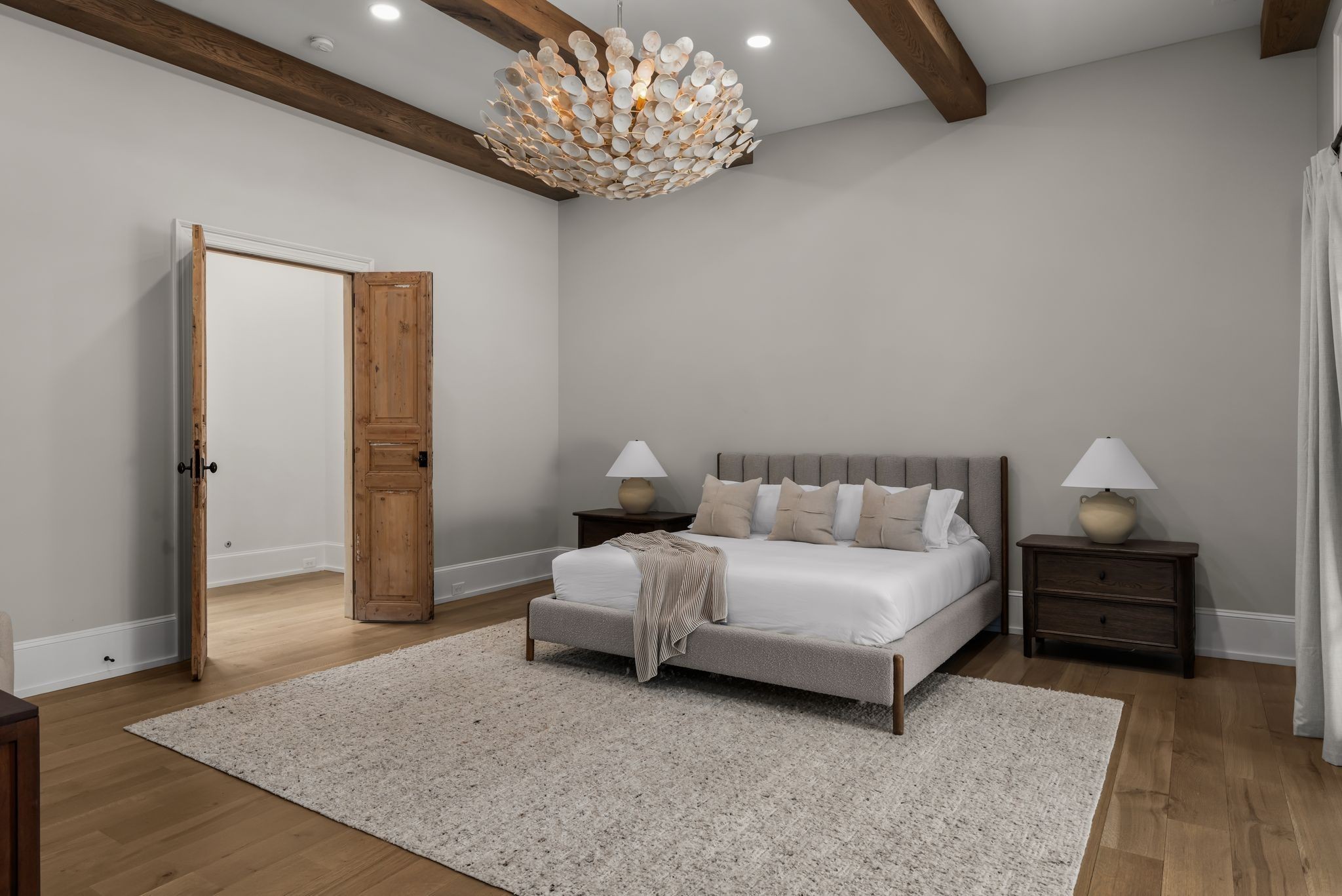 4301 Estes Road Nashville, TN 37215 - Photo 22 of 65 a spacious bedroom with a bed and a chandelier