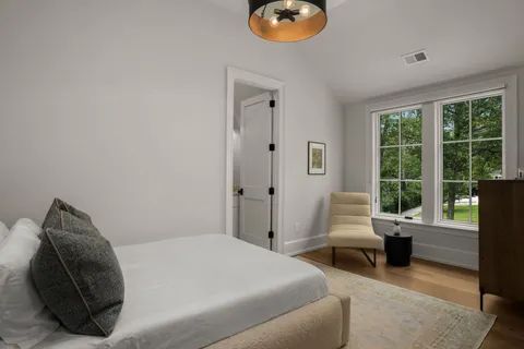 a view of a dining room with furniture and windows