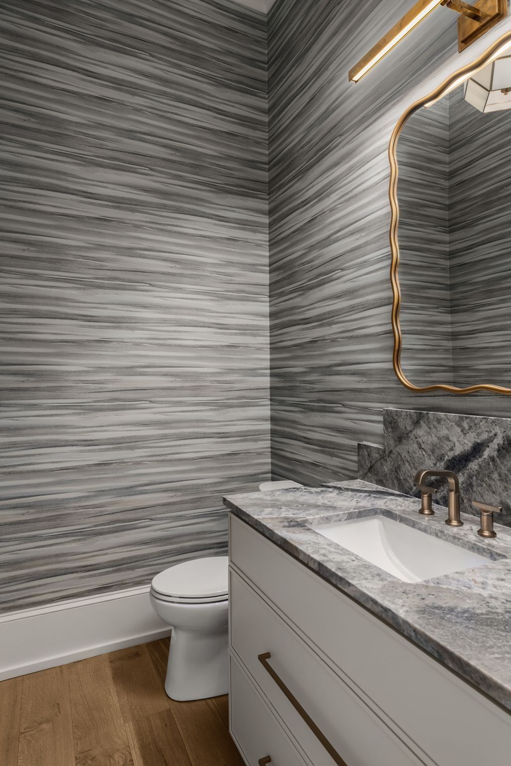 4301 Estes Road Nashville, TN 37215 - Photo 39 of 65 a bathroom with a granite countertop toilet a sink and mirror