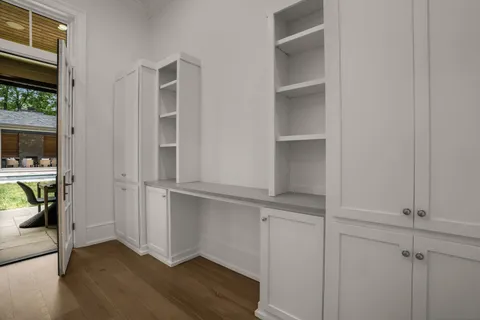 a aerial view of a house with swimming pool garden and patio