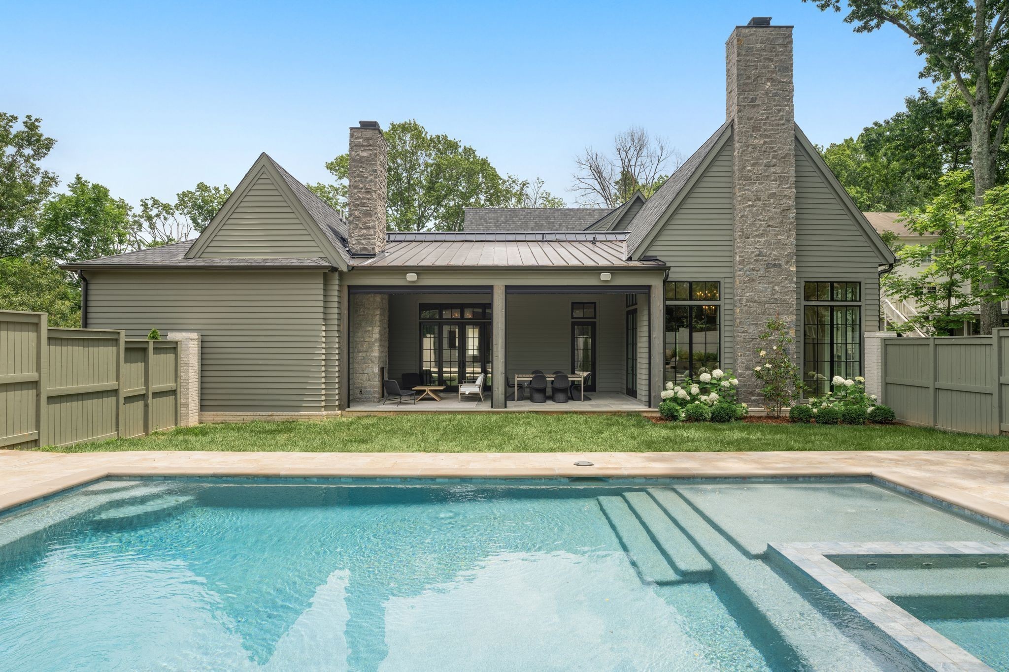 4301 Estes Road Nashville, TN 37215 - Photo 52 of 65 a view of a house with a yard and sitting area