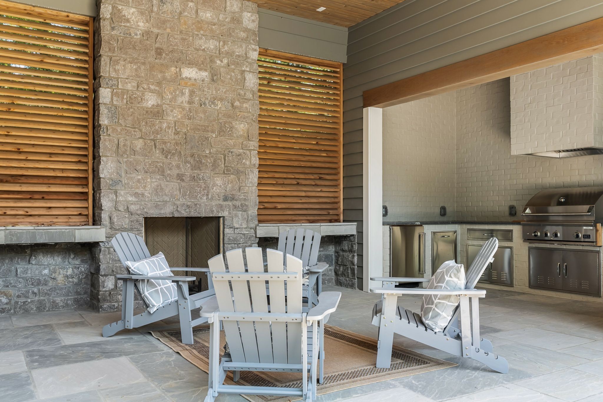 4301 Estes Road Nashville, TN 37215 - Photo 55 of 65 a view of a patio with a table and chairs and a barbeque