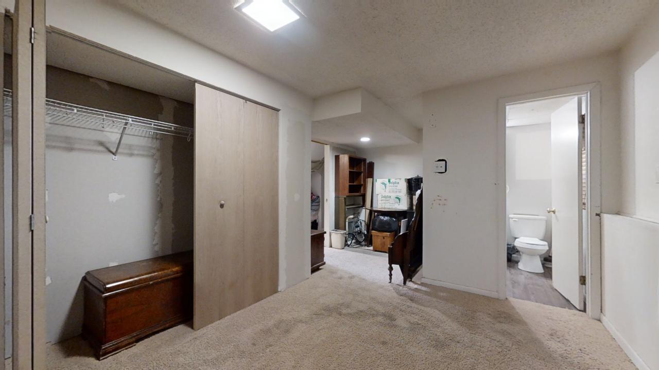 3656 North Meadowlark Drive Decatur, IL 62526 - Photo 24 of 31 a view of a hallway with workspace and a couch