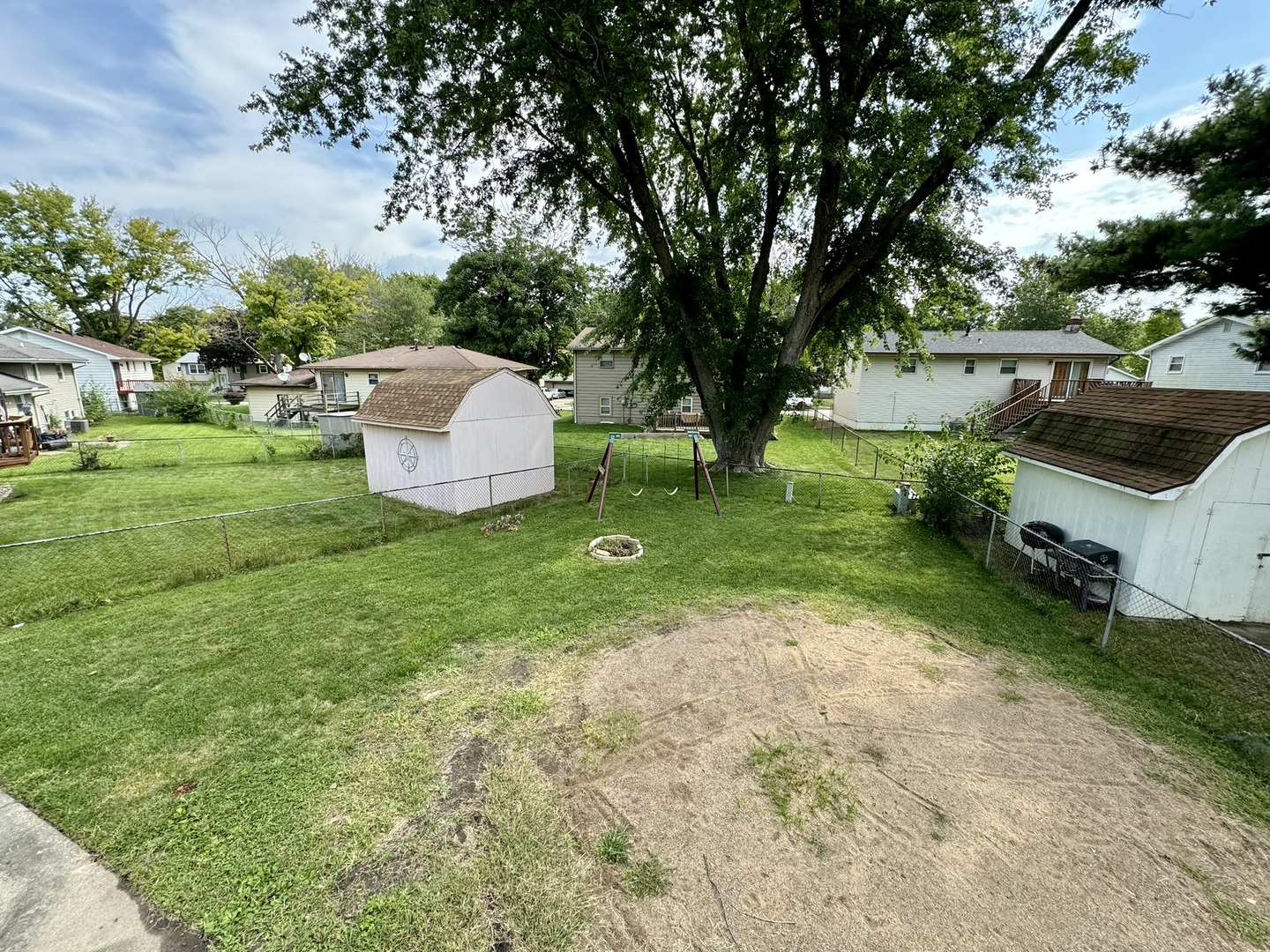 3656 North Meadowlark Drive Decatur, IL 62526 - Photo 30 of 31 a view of backyard with a garden and trees