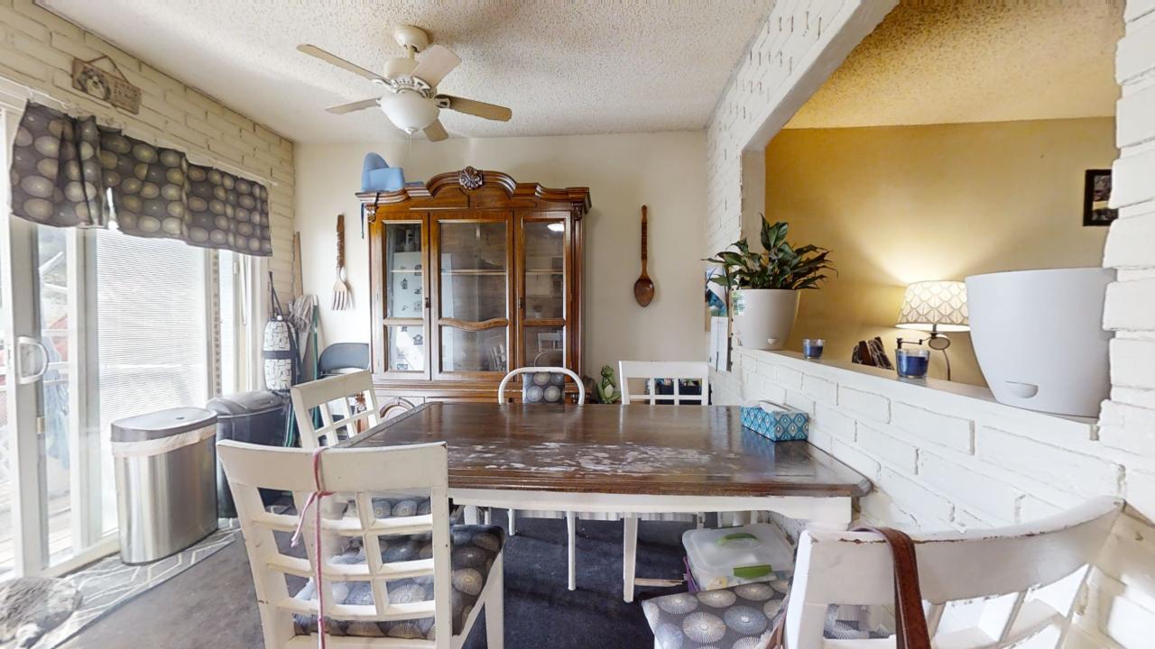 3656 North Meadowlark Drive Decatur, IL 62526 - Photo 7 of 31 a dining table with chairs and chandelier