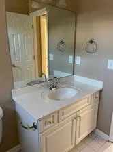 a bathroom with a sink and mirror