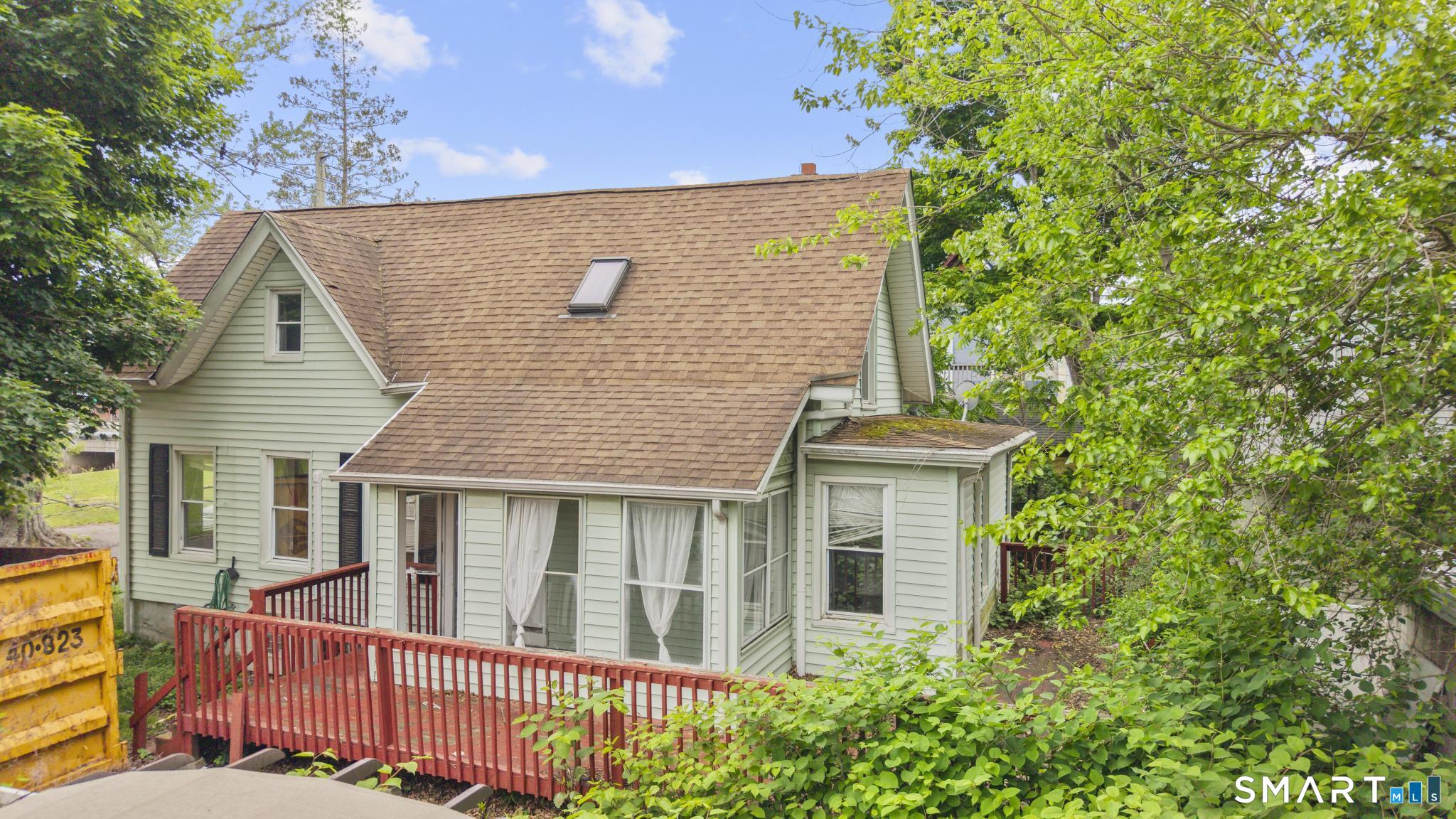 101 Meridian Street Meriden, CT 06451 - Photo 2 of 26 front view of a house with a small yard