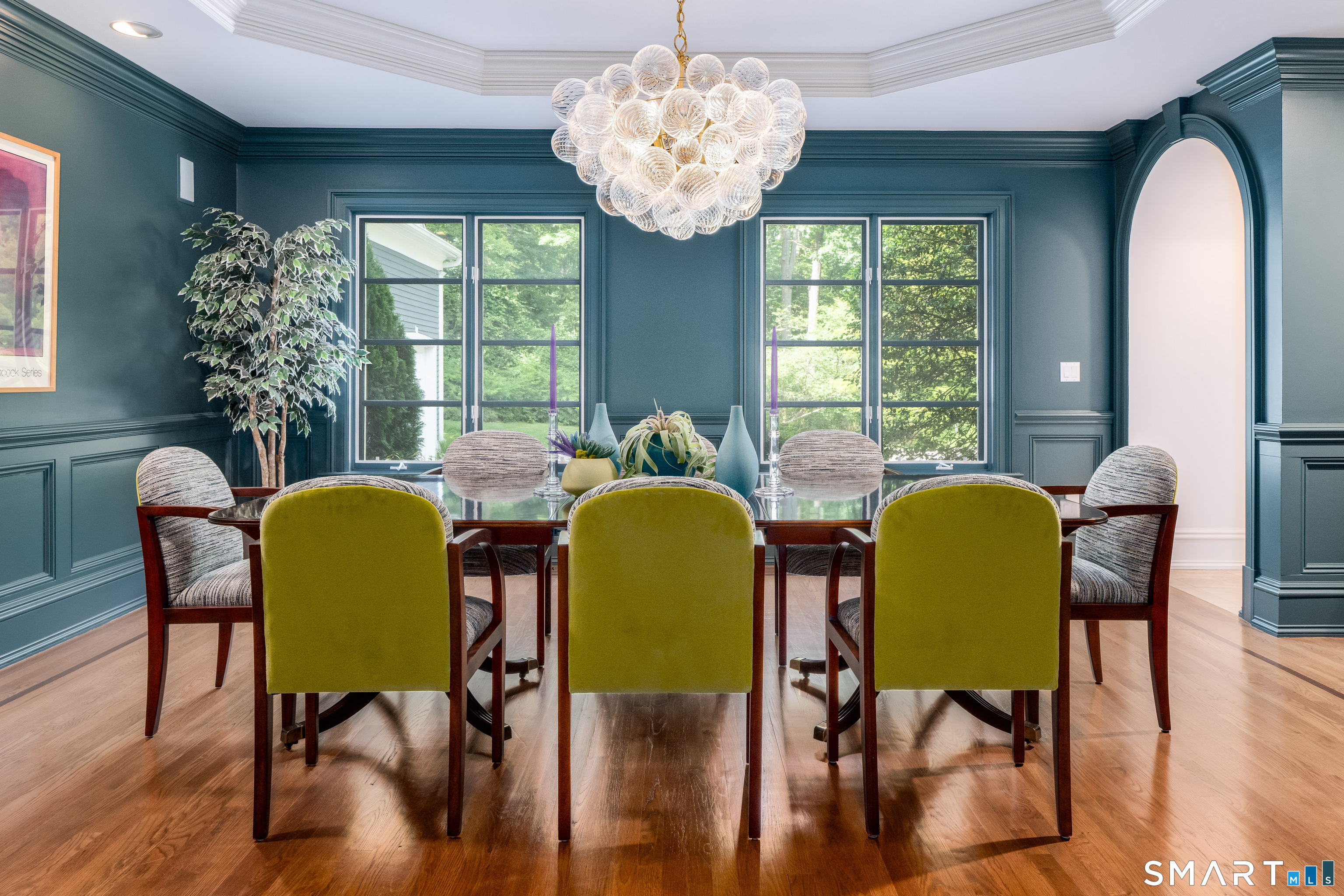 760 Smith Ridge Road New Canaan, CT 06840 - Photo 10 of 40 a view of a dining room with furniture and wooden floor