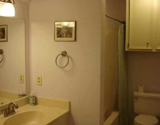 3921 Orrel Circle Corpus Christi, TX 78410 - Photo 7 of 10 a bathroom with a granite countertop toilet and a sink