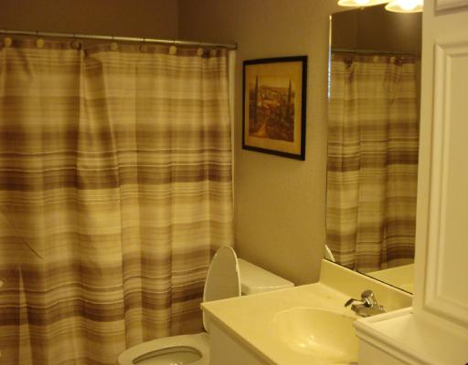 3921 Orrel Circle Corpus Christi, TX 78410 - Photo 8 of 10 a bathroom with a sink and a shower